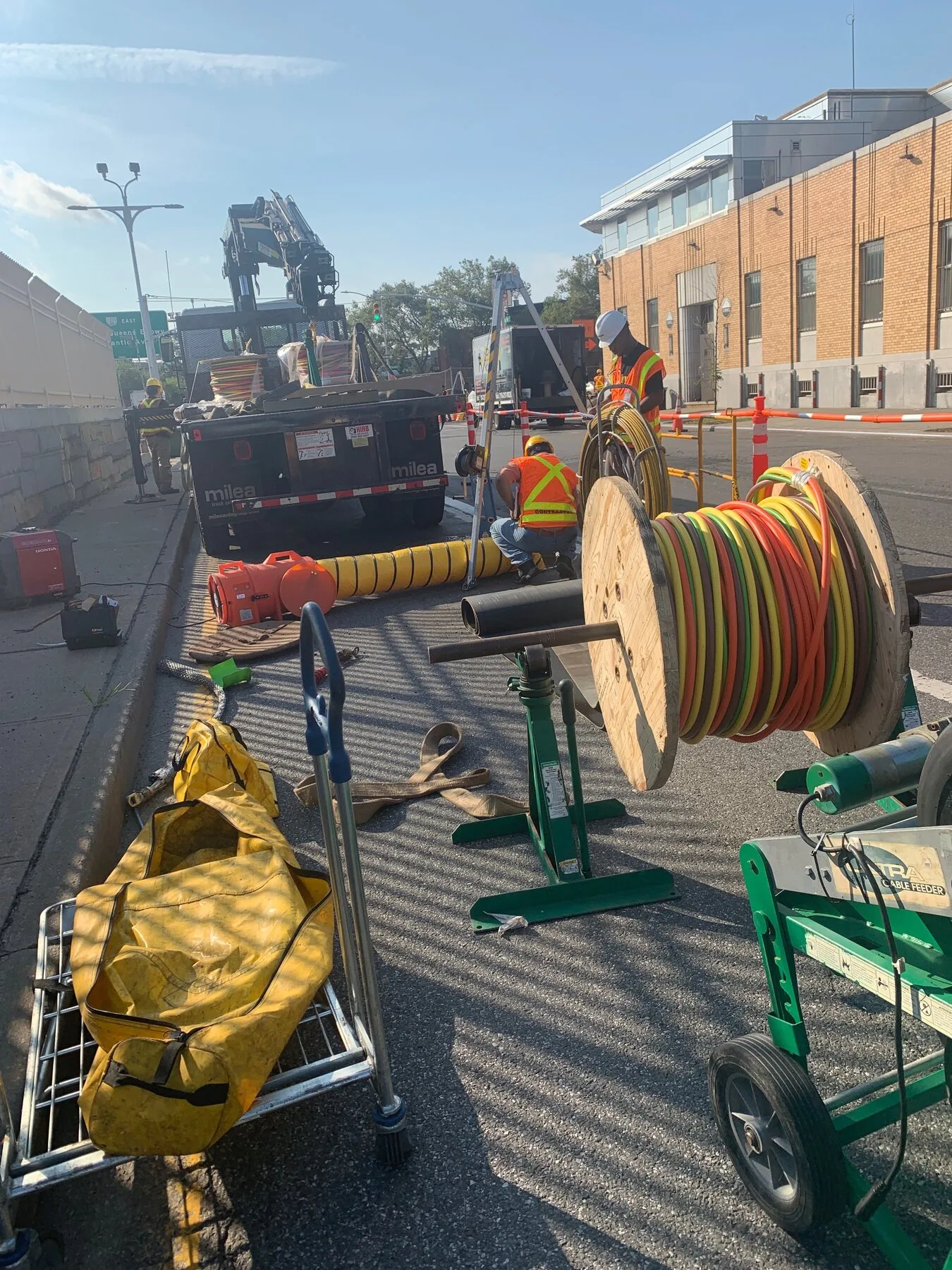 Large cable reels staged at an active construction site