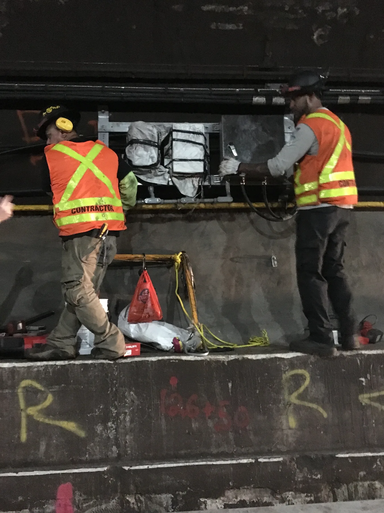 Electrical crew working in an underground infrastructure space