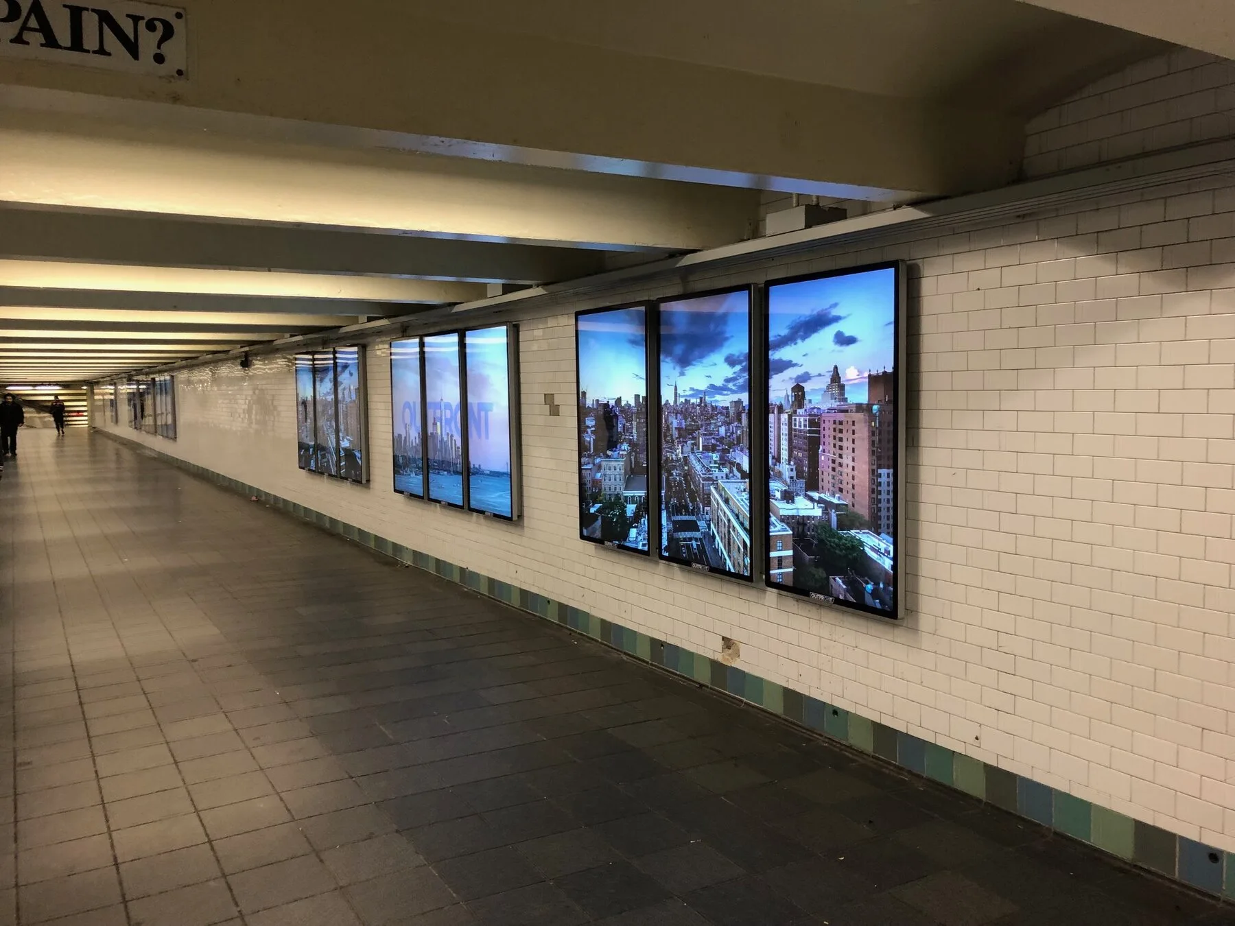 Digital display installation in a subway concourse